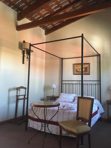 Una cama o camas en una habitación de Posta Torreón