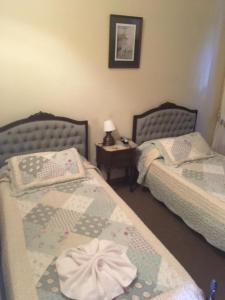 Una cama o camas en una habitación de Posta Torreón