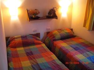 Ένα ή περισσότερα κρεβάτια σε δωμάτιο στο Cabañas Empedrada