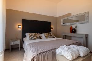 Postel nebo postele na pokoji v ubytování Hotel Stella D'Oro