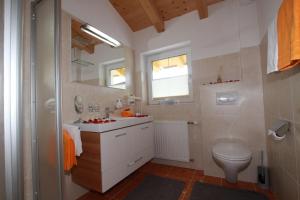 a bathroom with a sink and a toilet at Apart Anna in Nauders +35 photos