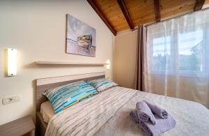 Cama o camas de una habitación en Apartments Mama
