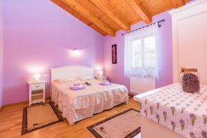 Postel nebo postele na pokoji v ubytování Villa Anita