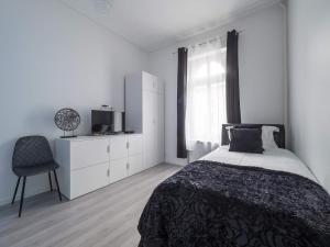 EXECUTIVE SINGLE ROOM WITH EN-SUITE in GUEST HOUSE CITY CENTRE房間的床