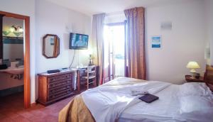 Voodi või voodid majutusasutuse Hotel Il Querceto toas