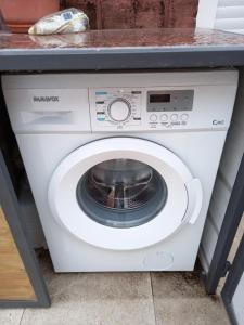 a washing machine with a bowl inside of it at Monoambiente en Colonia in Colonia del Sacramento