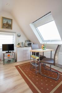 TV a/nebo společenská místnost v ubytování Casa Felicitas - Ferienwohnung & Studio