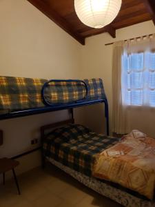 Ένα ή περισσότερα κρεβάτια σε δωμάτιο στο Casita de las Sierras
