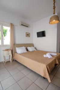 Voodi või voodid majutusasutuse Marias Rooms toas
