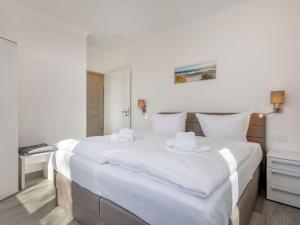 Ein Bett oder Betten in einem Zimmer der Unterkunft Villa Vogue Wohnung Nr. 11