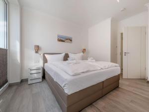 Ein Bett oder Betten in einem Zimmer der Unterkunft Villa Vogue Wohnung Nr. 11