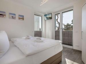 Ein Bett oder Betten in einem Zimmer der Unterkunft Villa Vogue Wohnung Nr. 11