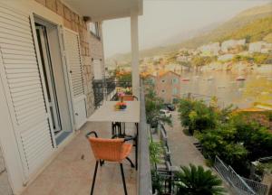 an apartment balcony with a view of a river at Apartments Mitrovići Miločer in Sveti Stefan