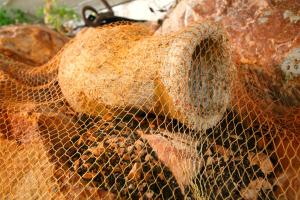a pile of food in a net at Apartments Mitrovići Miločer in Sveti Stefan