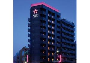 a tall building with a flower on the top of it at Sakura Sky Hotel - Vacation STAY 18432v in Tokyo
