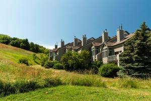 a house on the side of a hill at Blue Mountain Resort Home Collection in Blue Mountains