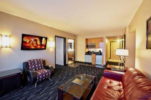 a living room with a couch and a table at Suites at Elara Las Vegas Strip-No Resort Fees in Las Vegas