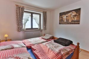 Кровать или кровати в номере Ferienwohnung Alpenfreude