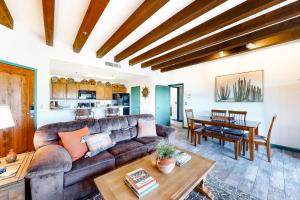 a living room with a couch and a table at Starr Pass Golf Casita in Tucson
