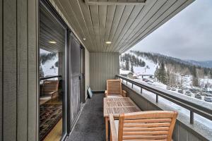 a balcony with benches and a view of the snow at Whitefish Mtn Ski-in and Out Condo Steps to Slopes! in Whitefish