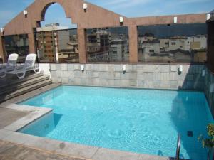 a swimming pool on the roof of a building at South American Copacabana Hotel in Rio de Janeiro