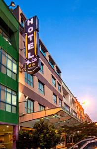 a building with a sign on the side of it at YANGTZE HOTEL 长江酒店 in Johor Bahru