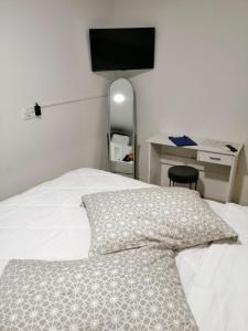 Postel nebo postele na pokoji v ubytování Pearl Apartment