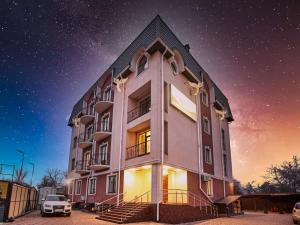 a building with a car parked in front of it at Ангел комфорт in Kyiv