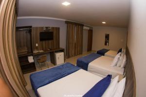 Et tv og/eller underholdning på Pousada Villarejo Armação