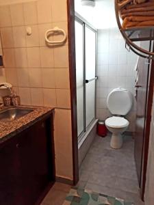 a bathroom with a toilet and a sink at Departamentos Maryan in San Luis