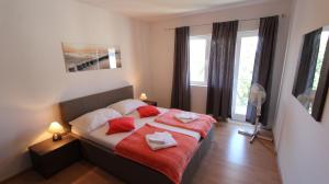 Postel nebo postele na pokoji v ubytování Apartments Stijak-Sorum