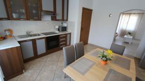 Kuchyň nebo kuchyňský kout v ubytování Apartments Stijak-Sorum