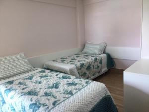 a room with two beds in a room at La Fleur Polinésia Muro Alto in Porto De Galinhas +46 photos