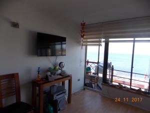 TV a/nebo společenská místnost v ubytování DPTO. PRIMERA LINEA VISTA DIRECTA A LA COSTA