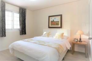 Tops10 Resort Donggang Cistar客房内的一张或多张床位