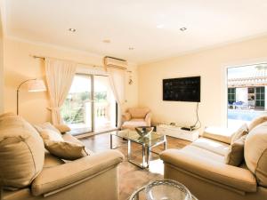 a living room with two couches and a tv at Belvilla by OYO Casa Aim Eri in Alcudia