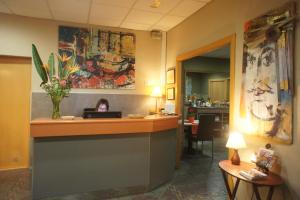 a hotel lobby with a reception desk and a dining room at Hotel MR in Tarragona
