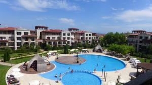 a view of a large swimming pool in a resort at Green Life Pool View Apartment in Sozopol