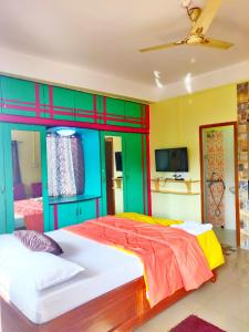 Voodi või voodid majutusasutuse Kanchans Nest I Rooms & Suites near Port Blair Airport toas