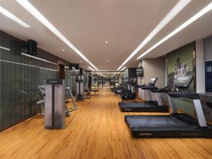 a gym with treadmills and elliptical machines at Novotel Changsha International Exhibition Center in Changsha