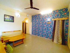 Voodi või voodid majutusasutuse Kanchans Nest I Rooms & Suites near Port Blair Airport toas