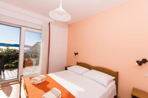 Posteľ alebo postele v izbe v ubytovaní Apartments Mastelić