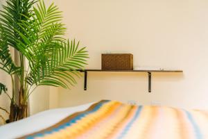 Postelja oz. postelje v sobi nastanitve Fun Trip - Fu May Sea View Holiday house l 無敵海景交誼廳 l 附汽機車租賃 l