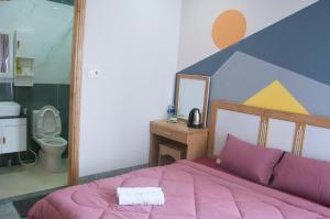 Postel nebo postele na pokoji v ubytování COCA HOTEL & APARTMENT