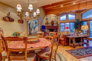 a dining room with a table and chairs at Twin Pines #2 in Park City