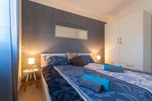 Postel nebo postele na pokoji v ubytování Apartments Didi