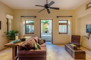a living room with a couch and a ceiling fan at 1037 - Villa Escondida in Santa Cruz Huatulco