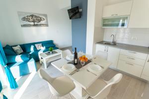 Kuchyň nebo kuchyňský kout v ubytování Apartments Didi