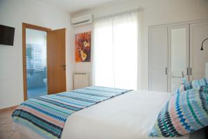 Ένα ή περισσότερα κρεβάτια σε δωμάτιο στο B&B Etna Europa