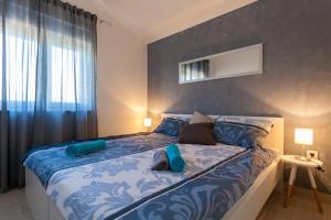 Postel nebo postele na pokoji v ubytování Apartments Didi